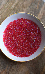 Load image into Gallery viewer, Transparent A.B Red Charlotte Beads 11/0

