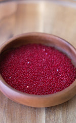 Load image into Gallery viewer, Transparent Ruby Charlotte Beads 11/0
