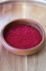 Load image into Gallery viewer, Transparent Ruby Charlotte Beads 11/0
