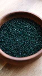 Load image into Gallery viewer, Matte Deep Green Transparent Charlotte Beads 11/0
