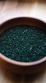 Load image into Gallery viewer, Matte Deep Green Transparent Charlotte Beads 11/0
